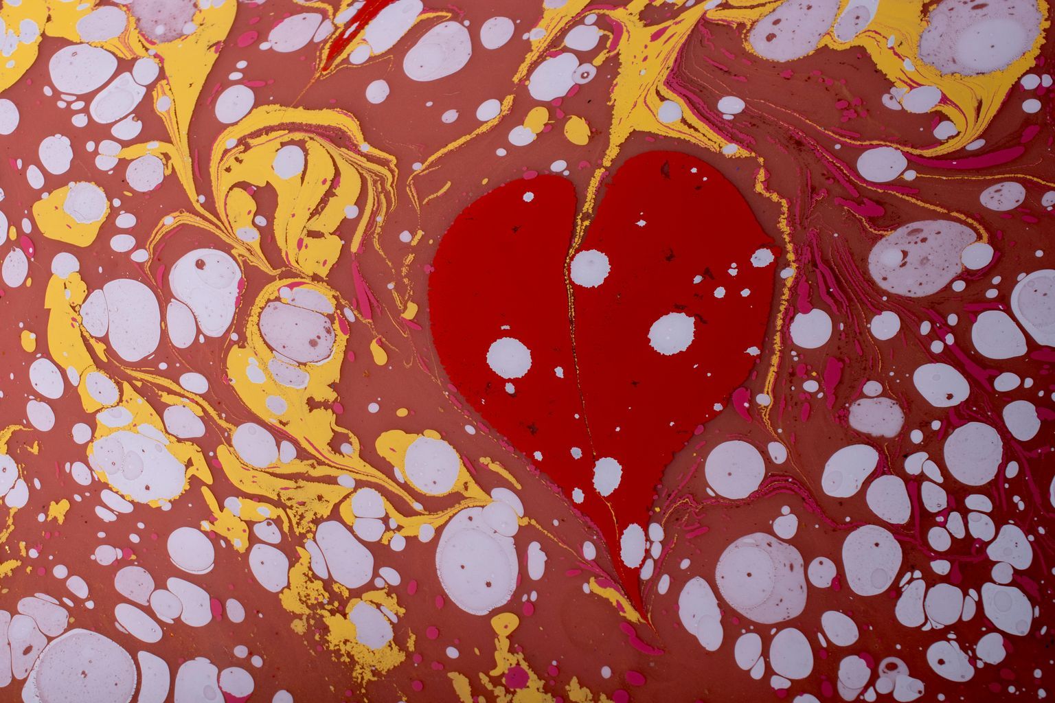 A red heart with bubbles and bubbles on it