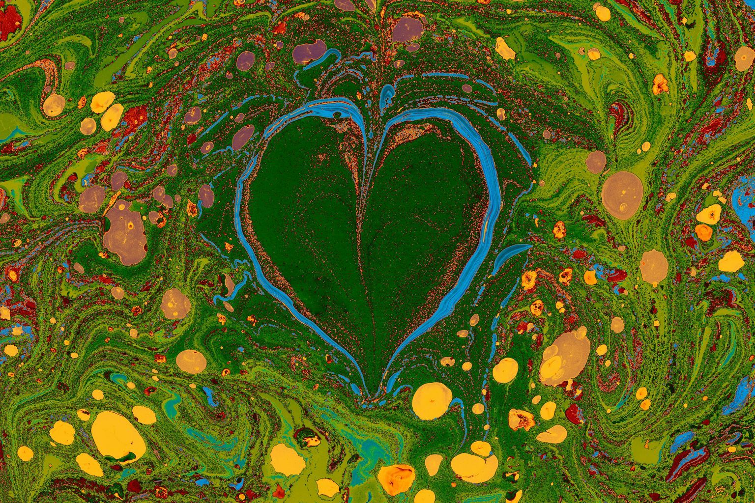 A painting of a heart with green and yellow paint