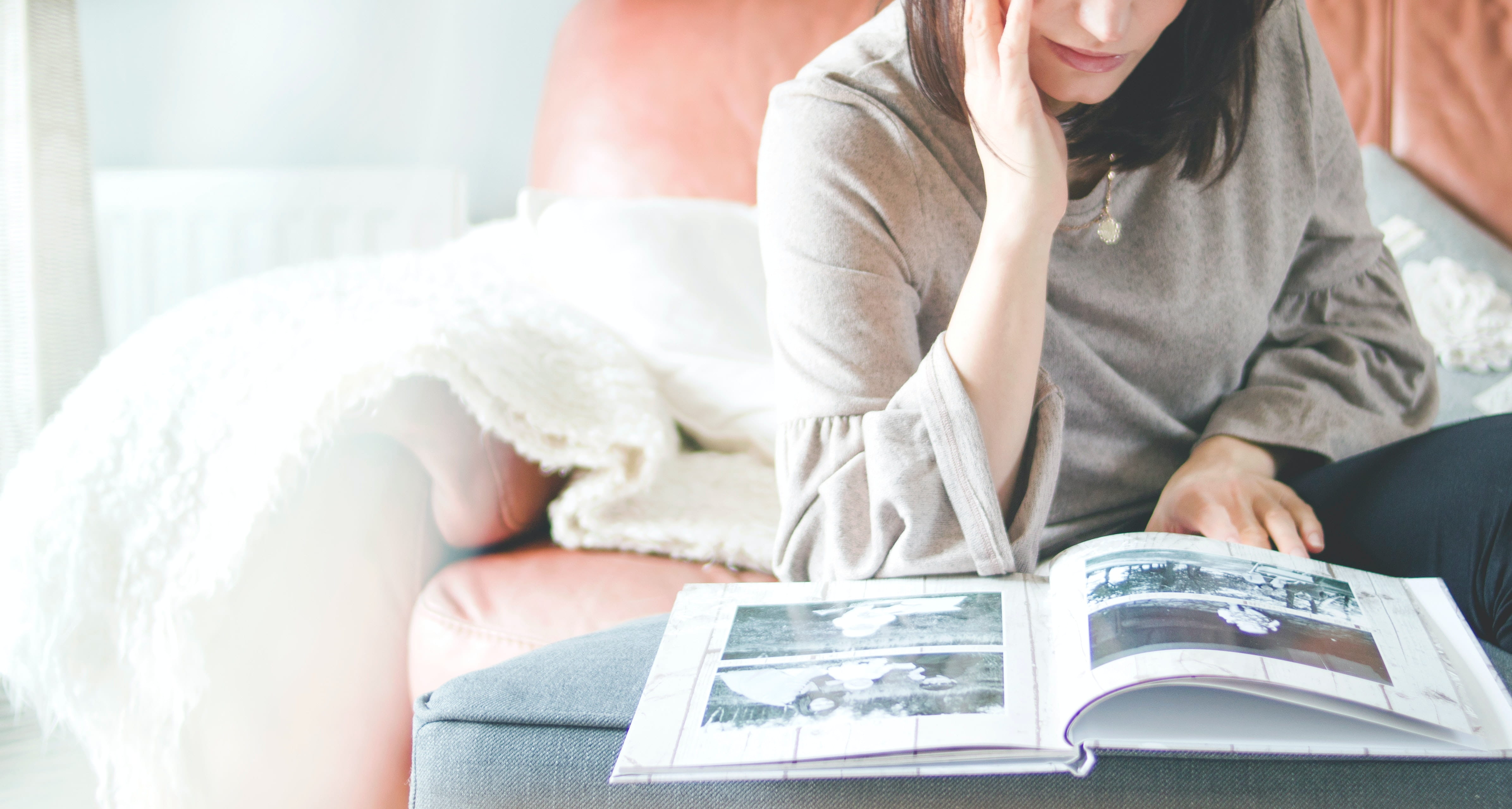 Woman looking at old photos, old memories