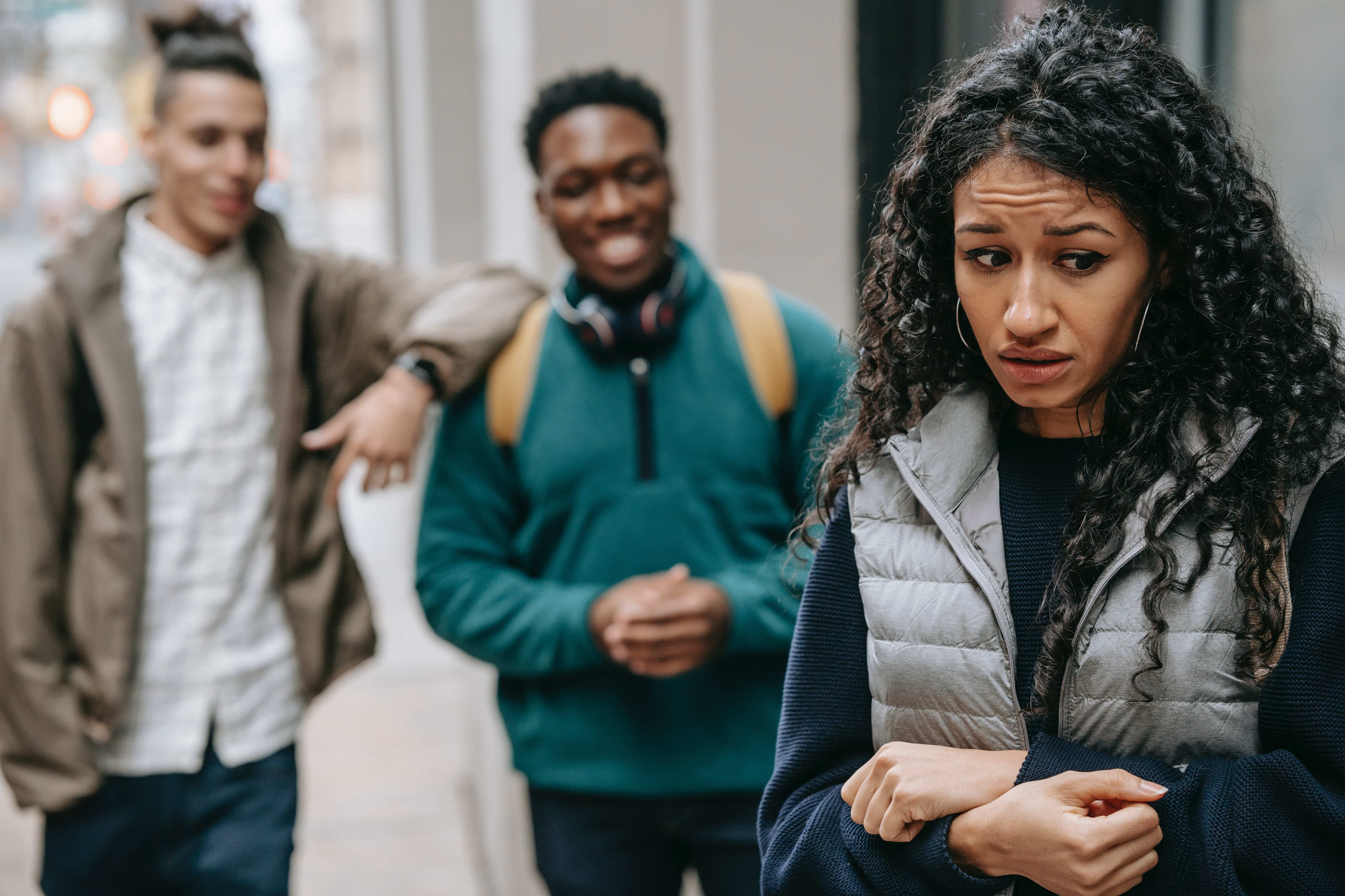 Woman feeling uncomfortable around her peers