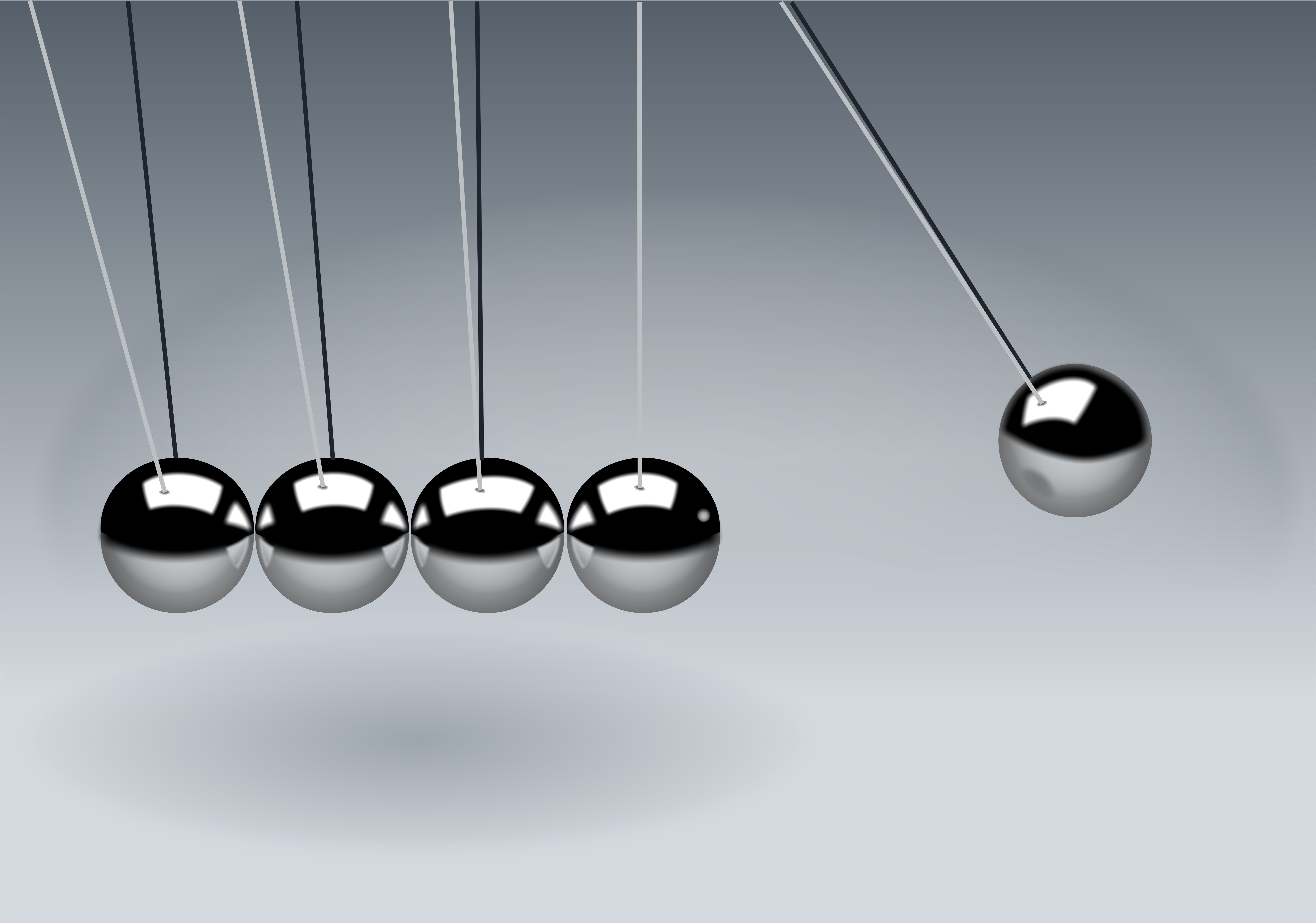 Newton's cradle; a chain of pendulums, symbolizing cause-effect chains.